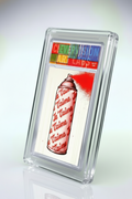 Card with a red spray can and 'Je T'aime' text, framed in clear plastic