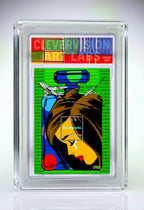 Collectible card with colorful design of a woman's face and text, encased in clear plastic.