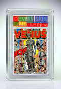 Comic book cover featuring 'Venus' with colorful text and graphics, encased in a protective frame.