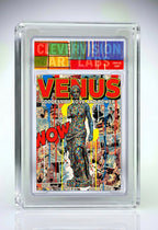 Comic book cover featuring 'Venus' with colorful text and graphics, encased in a protective frame.