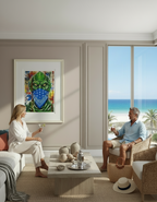 Two people sitting in a modern living room with a beach view.  Artwork on wall of Creature From Black Lagoon with mask on face, art by Mr. Clever Art.