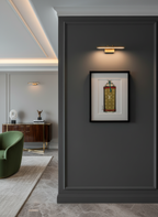 Framed artwork on a dark wall in a modern interior setting