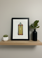 Framed artwork of a spray can on a shelf with decorative items.