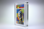 Framed artwork of 'Girl with a Pearl Earring' by Johannes Vermeer on a gray background