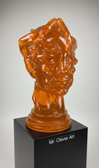 Amber glass sculpture on a black pedestal with 'Mr. Clever Art' branding.