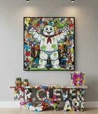 Colorful abstract painting of a character on a wall above a similarly decorated table.