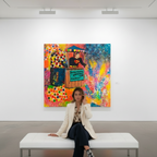 Person sitting on a bench in front of a colorful painting in an art gallery.