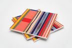 Stack of modern abstract art prints with vertical stripes and color blocks